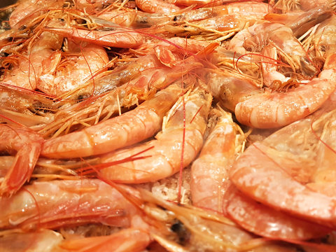 Full image of shrimp frying on a restaurant grill