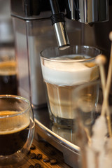 Cappuccino coffee making process in a coffee machine
