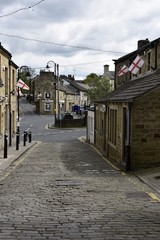 Cobbled street leeding to main road, Huddersfield Yorkshire England 06/05/2019