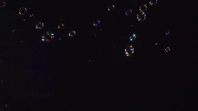 Soap bubbles on black background 4K