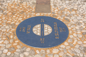 A plaque on the border where there was once a wall in Piazza Della Transalpina, Trg Evrope in Slovenian. The square is divided between Gorizia in Italy and Nova Gorica in Slovenia - obrazy, fototapety, plakaty