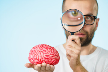 Man looking at human brain