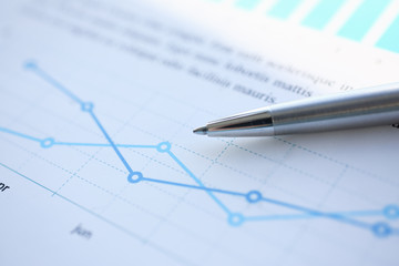 Financial statistics documents ball pen infographics at office table closeup. Internal Revenue Service inspector sum check investigation exchange market earnings savings loan and credit concept