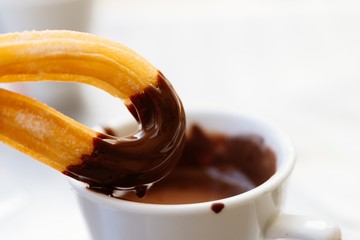 Delicious Spanish dessert churros with chocolate sauce