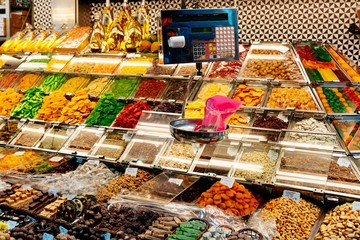Dried fruits and sweets on market stall