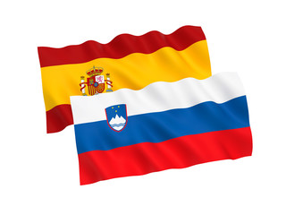 National fabric flags of Slovenia and Spain isolated on white background. 3d rendering illustration. Proportion 1:2