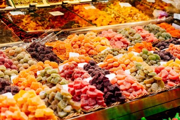 Dried fruits and sweets on market stall