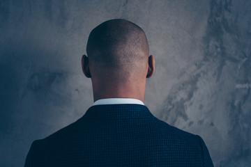 Back rear behind closeup view photo portrait of thoughtful handsome guy looking back isolated grey background - Powered by Adobe
