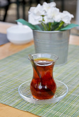cup of Turkish tea on wooden table