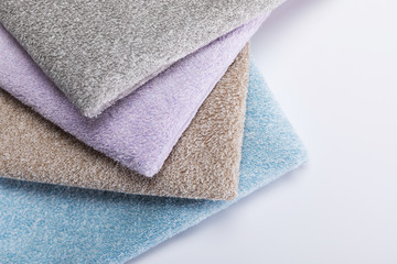 Pink white blue stacked towels