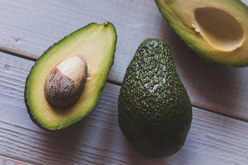 closeup Avocado halves on the wooden withe table