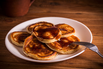 Fresh homemade pancakes on rustic wooden table