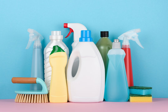 Cleaning supplies on pastel background