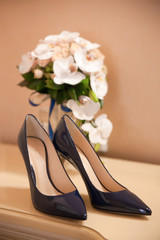 wedding attributes: women's shoes, bridal bouquet