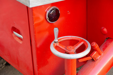 mechanical rotary knob to extend the support of the old fire truck