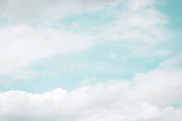 White clouds on the light blue aquamarine color sky background