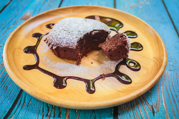 Homemade chocolate cake decorated with  chocolate sauce.