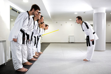 Skilled martial artists preparing to begin training