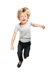 Jumping little boy on white background