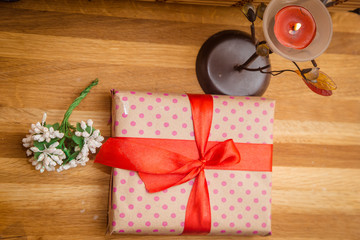 a gift with a red ribbon