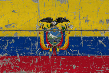 Grunge Ecuador flag on old scratched wooden surface. National vintage background.