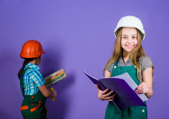Builder engineer architect. Kid worker in hard hat. Future profession. Tools to improve yourself. Repair. Child care development. small girls repairing together in workshop. violet background