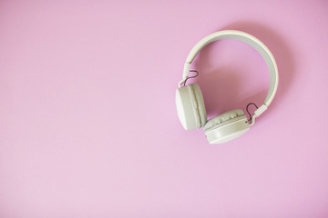 Headphones on pastel background.