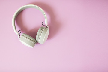 Headphones on pastel background.