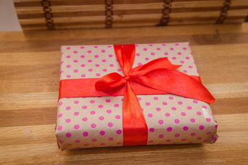 a gift with a red ribbon