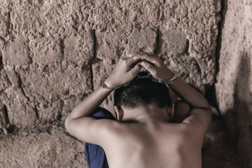 little boy with shackle. Abused and tortured concept. Human trafficking concept. © AungMyo