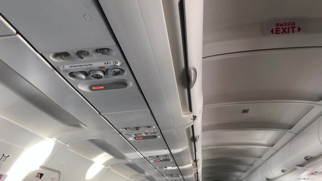 No smoking and seatbelt signs turning on before flight taking off and landing with blinking symbol graphic