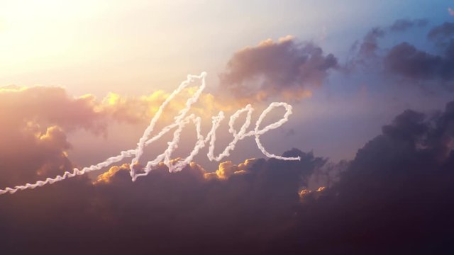 Airplane draws word Love on the sky