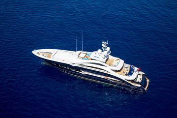 luxury motor yacht in the sea top view from a helicopter