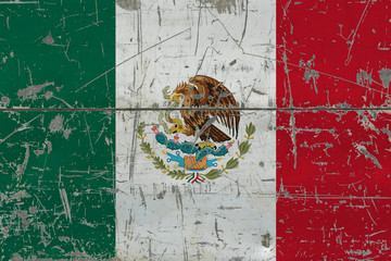 Grunge Mexico flag on old scratched wooden surface. National vintage background.
