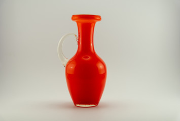 single orange vase on a white back ground