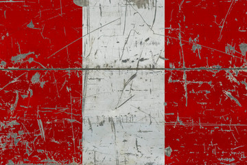 Grunge Peru flag on old scratched wooden surface. National vintage background.