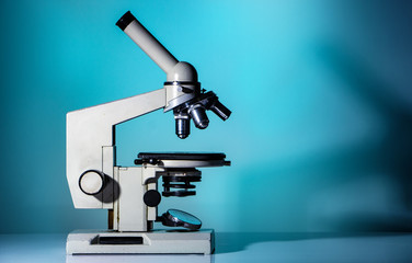 microscope lenses close up on green background