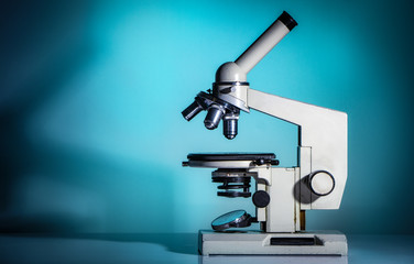 microscope lenses close up on green background