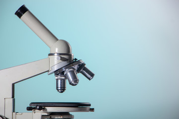 microscope lenses close up on green background