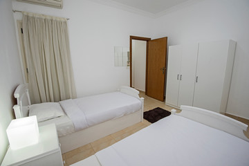 Fototapeta na wymiar Twin beds in a luxury apartment