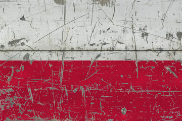 Grunge Poland flag on old scratched wooden surface. National vintage background.
