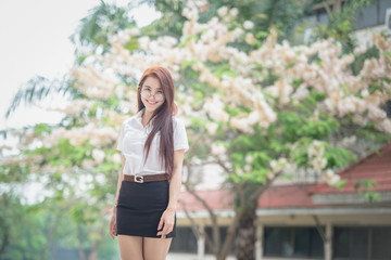 Obraz na płótnie Canvas Beautiful Thai university student wearing Thai university student uniform.