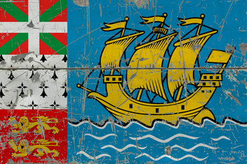 Obraz na płótnie Canvas Grunge Saint Pierre And Miquelon flag on old scratched wooden surface. National vintage background.