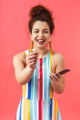 Vertical image of happy pretty redhead woman wearing in dress