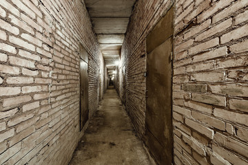Dark narrow corridor of the basement.