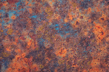 Beautiful old grungy cracked blue naturally weathered rust and wall paint peeling off rusted metal sheet. Textured loft stule background for posters and bloggers