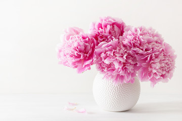 beautiful pink peony flowers bouquet in vase © Olga Miltsova