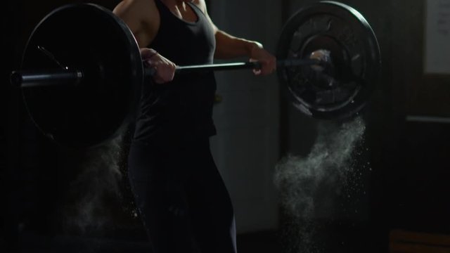 Young girl in crossfit gym working out