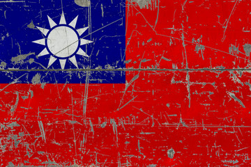 Grunge Taiwan flag on old scratched wooden surface. National vintage background.