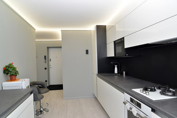 Fototapeta na wymiar Interior of modern kitchen in gray-black tones